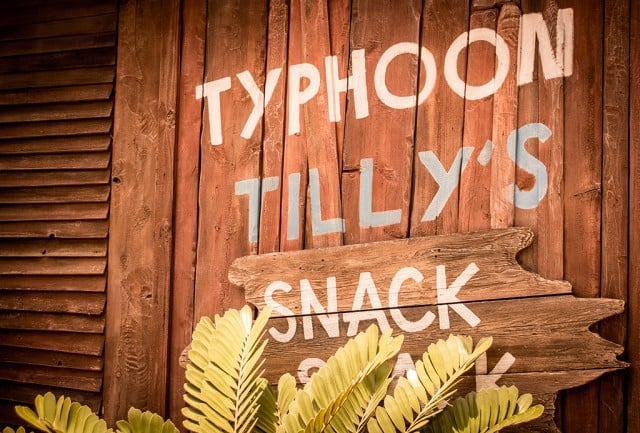 A rustic wooden sign for Typhoon Tilly's restaurant at Disney's Typhoon Lagoon, featuring nautical theming and weathered details that match the water park's shipwrecked atmosphere